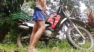 Sexy young man with his new motorbike